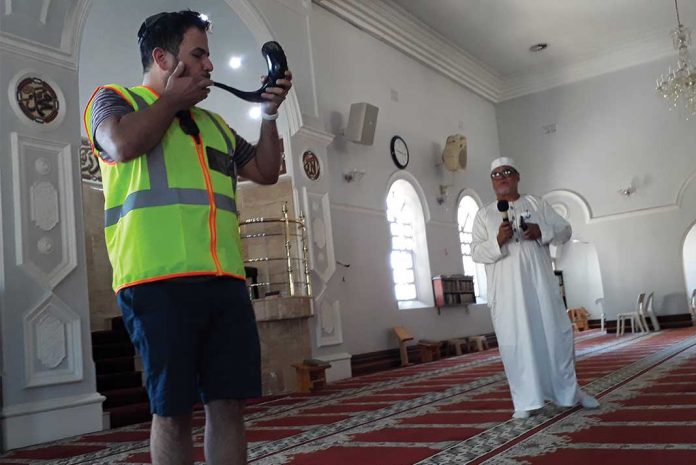 Stuart Diamond blows a shofar in the Muir Street Mosque alongside Sheikh Mogamat Moerat