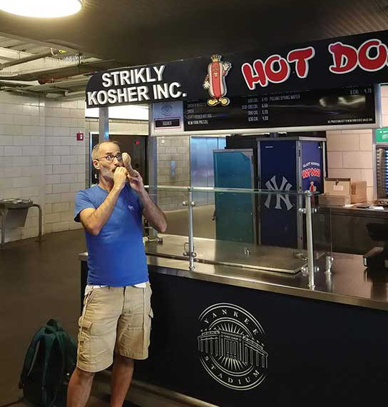 Rabbi Greg Alexander blowing the shofar at Yankee Stadium during Elul while on sabbatical in New York City with his family